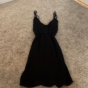Cross back black mini dress flowy
